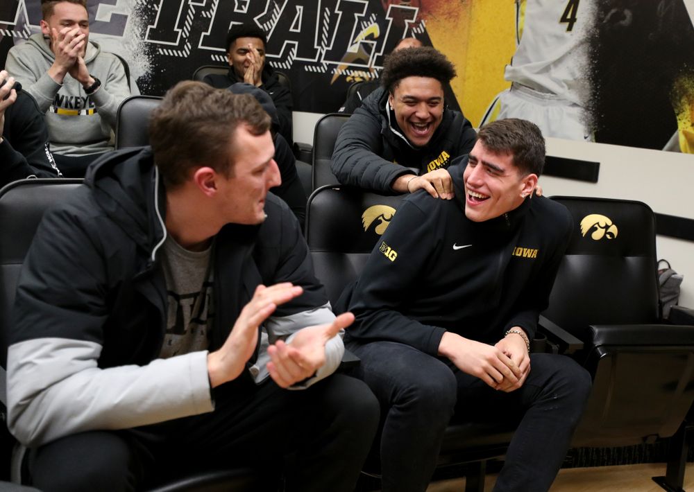 The Iowa Hawkeyes congratulate forward Luka Garza (55)  after finding out that he has been named the Big Ten Player of the Year Monday, March 9, 2020 at Carver-Hawkeye Arena. (Brian Ray/hawkeyesports.com)