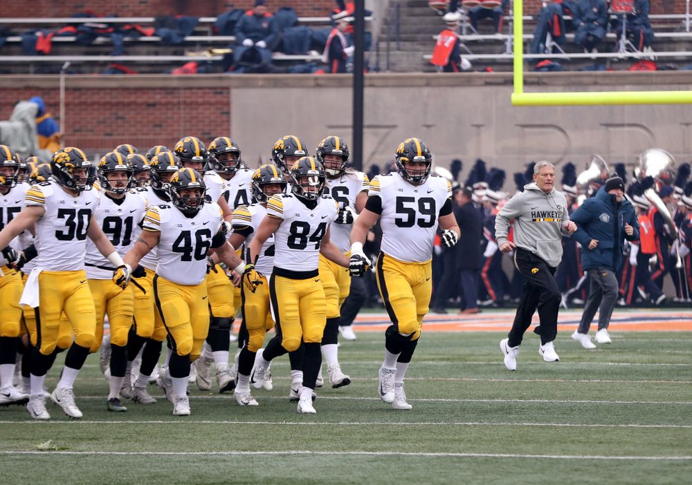 The Iowa Hawkeyes swarm onto the field for their game against the Illinois Fighting Illini Saturday, November 17, 2018 at Memorial Stadium in Champaign, Ill. (Brian Ray/hawkeyesports.com)