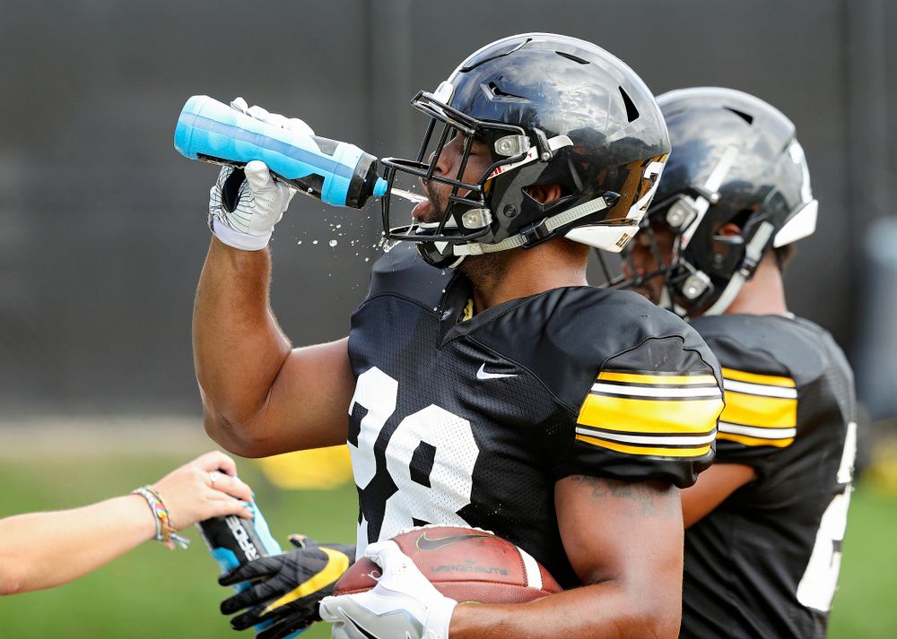 Iowa Hawkeyes running back Toren Young (28) gets a drink during Fall Camp Practice No. 11 at the Hansen Football Performance Center in Iowa City on Wednesday, Aug 14, 2019. (Stephen Mally/hawkeyesports.com)