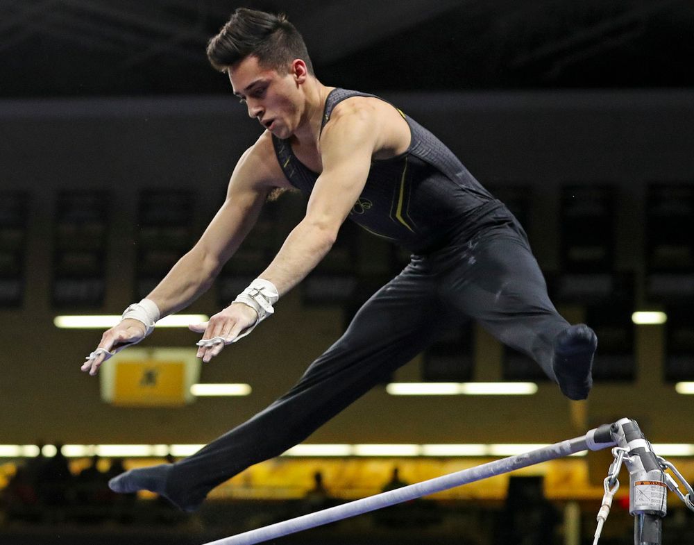 Iowa's Andrew Herrador competes in the horizontal bar during the first day of the Big Ten Men's Gymnastics Championships at Carver-Hawkeye Arena in Iowa City on Friday, Apr. 5, 2019. (Stephen Mally/hawkeyesports.com)