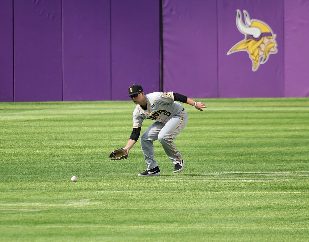 Iowa Hawkeyes outfielder Zeb Adreon (5) fields a ball during the fourth inning of their CambriaCollegeClassic game at U.S. Bank Stadium in Minneapolis, Minn. on Friday, February 28, 2020. (Stephen Mally/hawkeyesports.com)