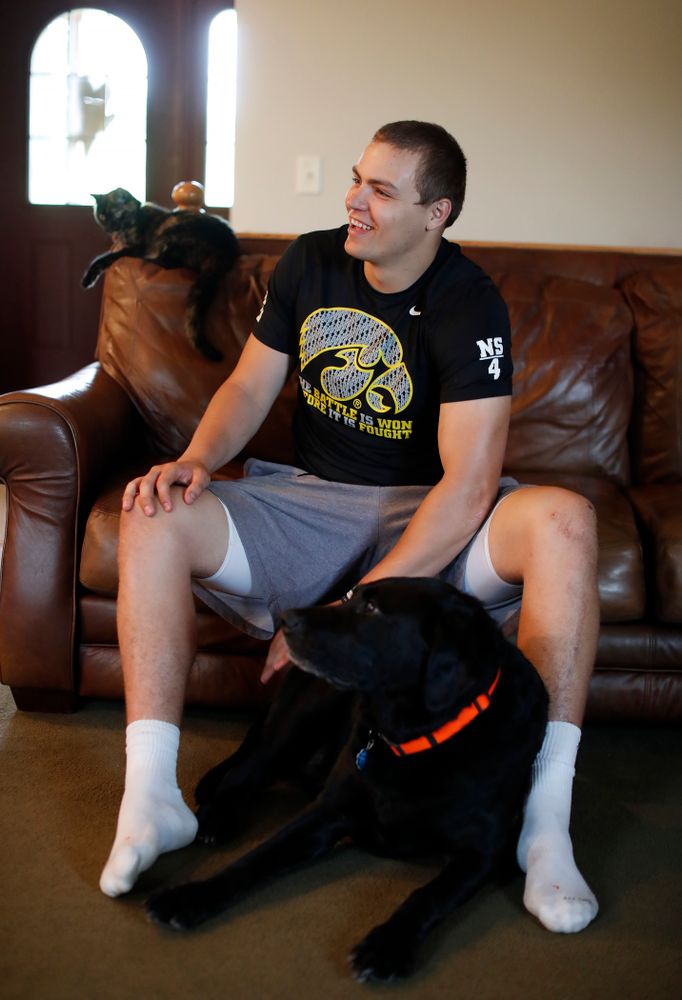 Iowa Hawkeyes quarterback Nathan Stanley (4) plays with his dog Onyx at his home Wednesday, May 30, 2018 in Menomonie, Wisc. (Brian Ray/hawkeyesports.com)
