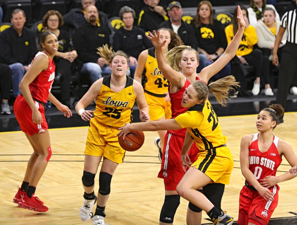Iowa Hawkeyes guard Kathleen Doyle (22) passes the ball to forward Monika Czinano (25) during the third quarter of their game at Carver-Hawkeye Arena in Iowa City on Thursday, January 23, 2020. (Stephen Mally/hawkeyesports.com)