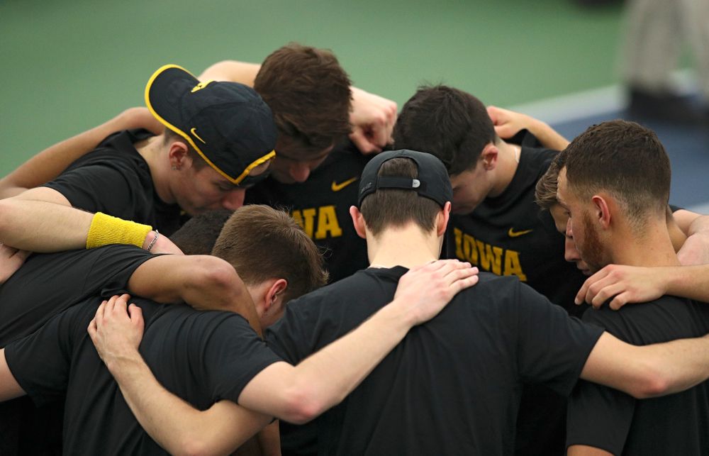 The Hawkeyes huddle before their match at the Hawkeye Tennis and Recreation Complex in Iowa City on Friday, March 6, 2020. (Stephen Mally/hawkeyesports.com)