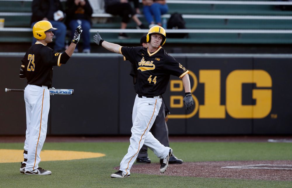 Iowa Hawkeyes outfielder Robert Neustrom (44) and infielder Kyle Crowl (23) against Milwaukee Wednesday, April 25, 2018 at Duane Banks Field. (Brian Ray/hawkeyesports.com)