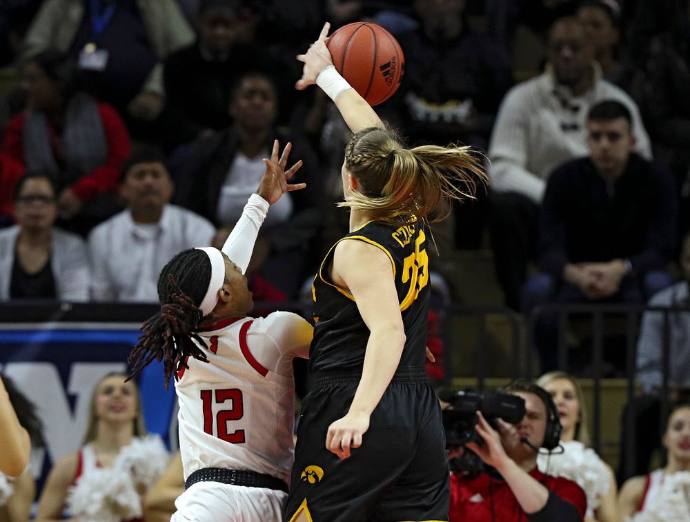 Iowa forward/center Monika Czinano (25) blocks a shot during the first quarter of their game at the Rutgers Athletic Center in Piscataway, N.J. on Sunday, March 1, 2020. (Stephen Mally/hawkeyesports.com)