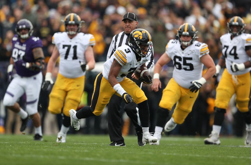 Iowa Hawkeyes wide receiver Tyrone Tracy Jr. (3) carries the ball on his way to a touchdown against the Northwestern Wildcats Saturday, October 26, 2019 at Ryan Field in Evanston, Ill. (Brian Ray/hawkeyesports.com)