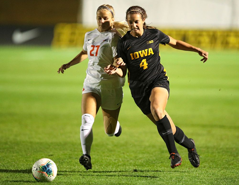 Iowa forward Kaleigh Haus (4) battles for position on the ball during the first half of their match against Illinois at the Iowa Soccer Complex in Iowa City on Thursday, Sep 26, 2019. (Stephen Mally/hawkeyesports.com)