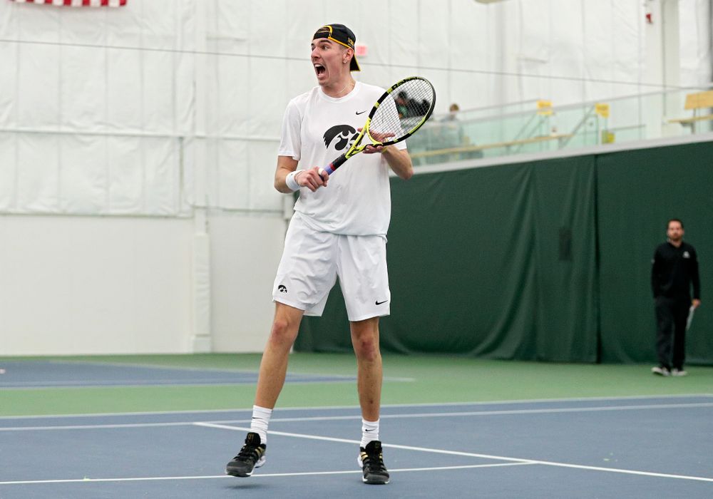 Iowa’s Nikita Snezhko celebrates a point during his doubles match at the Hawkeye Tennis and Recreation Complex in Iowa City on Sunday, February 16, 2020. (Stephen Mally/hawkeyesports.com)