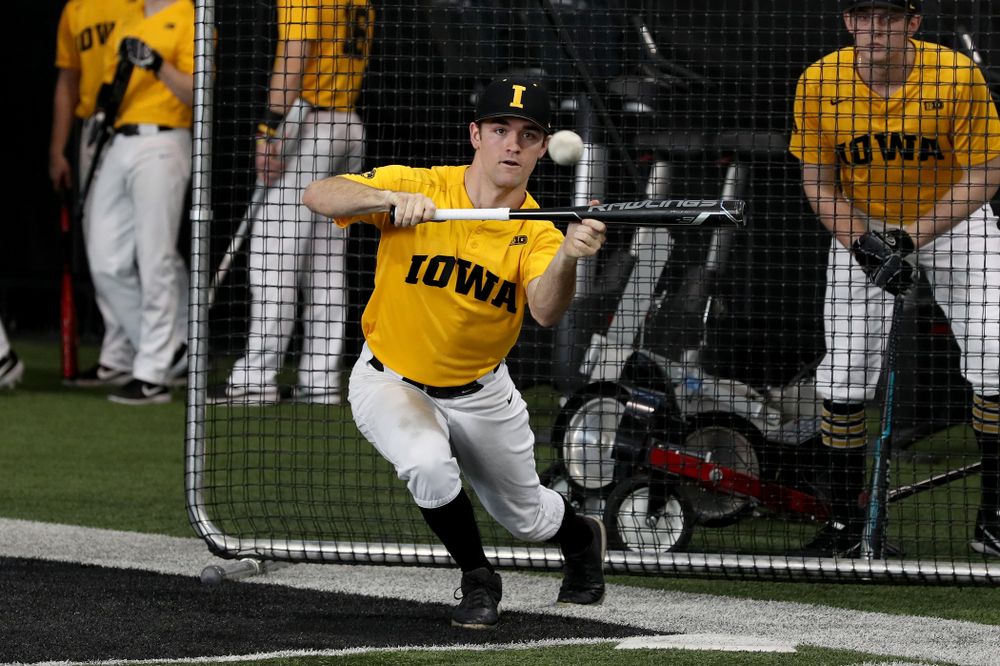 Iowa Hawkeyes outfielder Justin Jenkins (6) puts down a bunt during practice Thursday, February 6, 2020 at the Indoor Practice Facility. (Brian Ray/hawkeyesports.com)