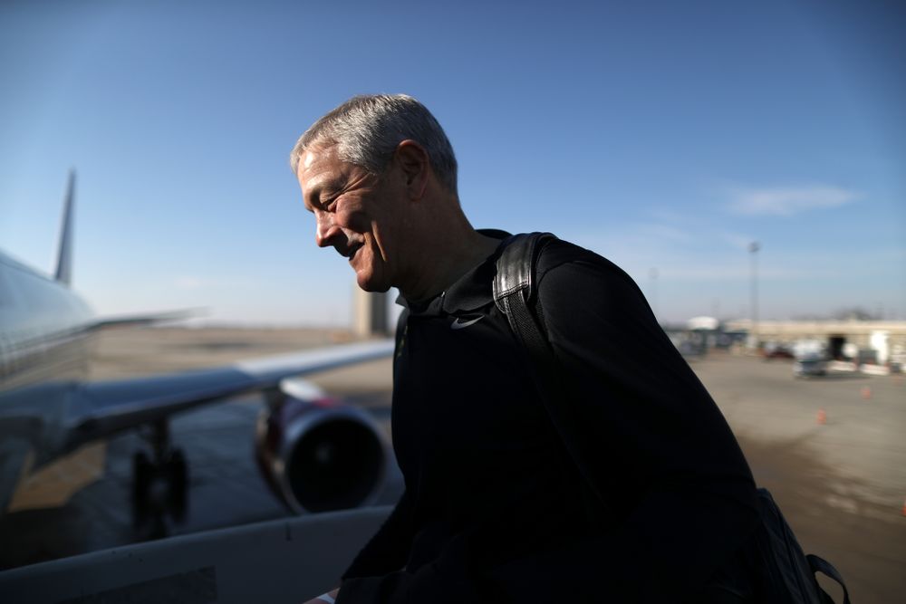 Iowa Hawkeyes head coach Kirk Ferentz boards the team plane at the Eastern Iowa Airport Saturday, December 21, 2019 on the way to San Diego, CA for the Holiday Bowl. (Brian Ray/hawkeyesports.com)