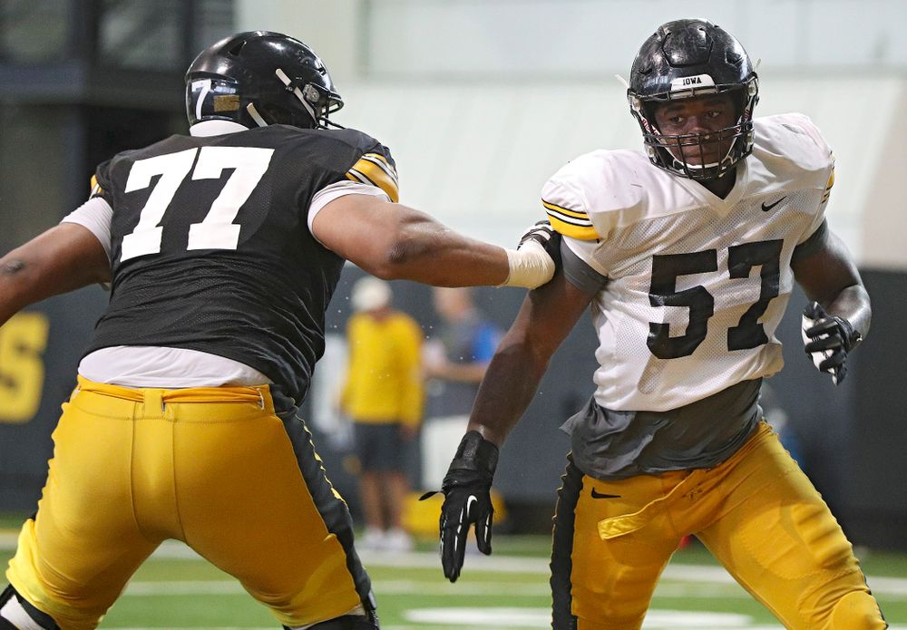 Iowa Hawkeyes offensive lineman Alaric Jackson (77) and defensive end Chauncey Golston (57) work on a drill during Fall Camp Practice No. 6 at the Hansen Football Performance Center in Iowa City on Thursday, Aug 8, 2019. (Stephen Mally/hawkeyesports.com)