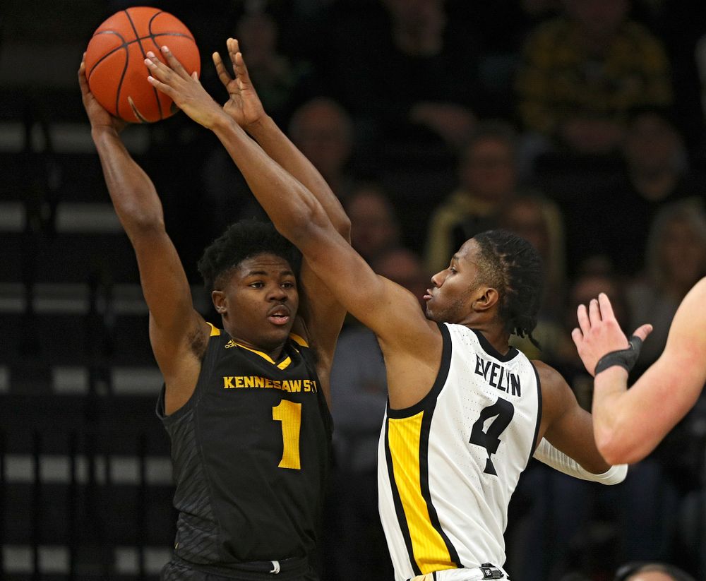 Iowa Hawkeyes guard Bakari Evelyn (4) gets his hands on a pass by Kennesaw State Owls guard Terrell Burden (1) during the first half of their their game at Carver-Hawkeye Arena in Iowa City on Sunday, December 29, 2019. (Stephen Mally/hawkeyesports.com)