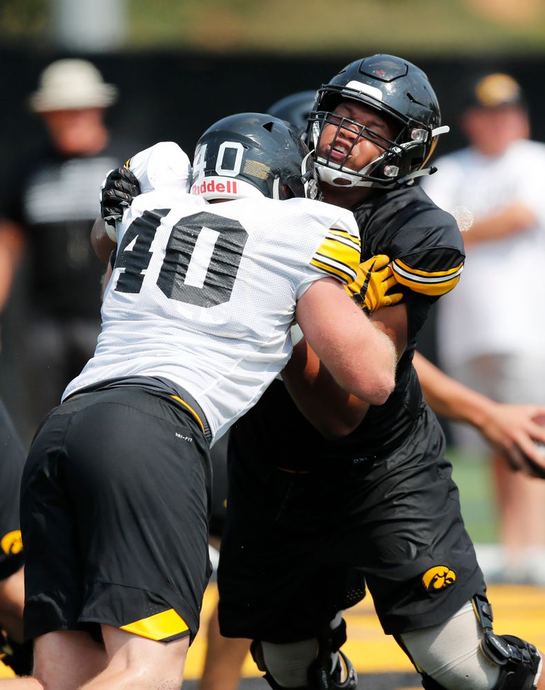 Iowa Hawkeyes offensive lineman Alaric Jackson (77) and defensive end Parker Hesse (40) during fall camp practice No. 9 Friday, August 10, 2018 at the Kenyon Practice Facility. (Brian Ray/hawkeyesports.com)