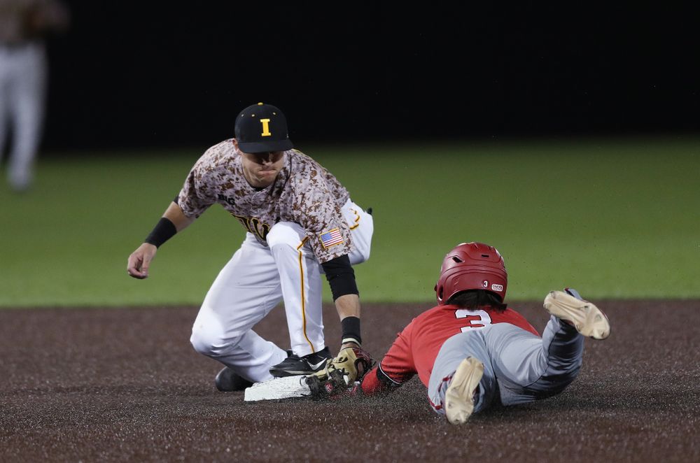 Iowa Hawkeyes Tanner Wetrich (16) tags out a runner at second against the Nebraska Cornhuskers on Military Appreciation Night Friday, April 19, 2019 at Duane Banks Field. (Brian Ray/hawkeyesports.com)