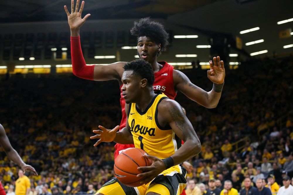 Iowa Hawkeyes guard Joe Toussaint (1) looks to pass the ball during the Iowa men’s basketball game vs Rutgers on Wednesday, January 22, 2020 at Carver-Hawkeye Arena. (Lily Smith/hawkeyesports.com)