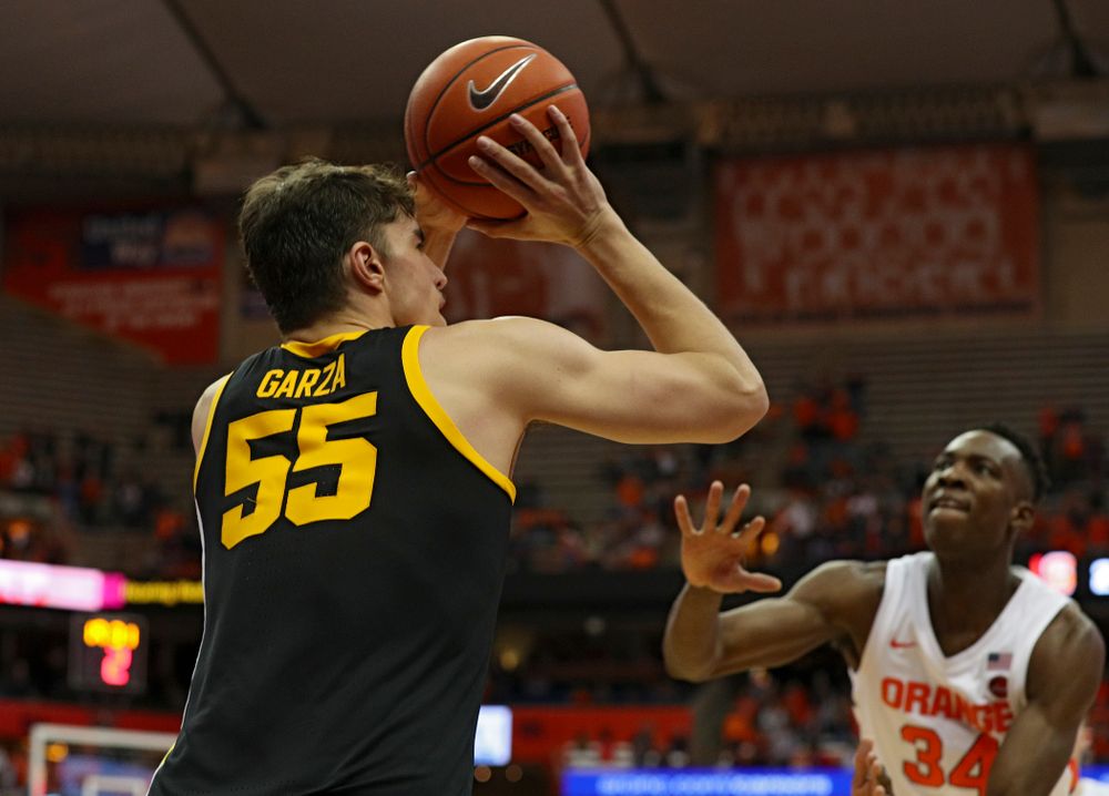 Iowa Hawkeyes center Luka Garza (55) makes a 3-pointer during the second half of their ACC/Big Ten Challenge game at the Carrier Dome in Syracuse, N.Y. on Tuesday, Dec 3, 2019. (Stephen Mally/hawkeyesports.com)