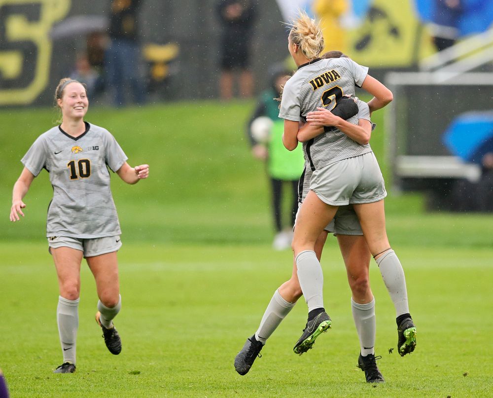 Iowa midfielder Hailey Rydberg (2) jumps into the arms of midfielder Josie Durr (25) after Rydberg scored a goal during the first half of their match at the Iowa Soccer Complex in Iowa City on Sunday, Sep 29, 2019. (Stephen Mally/hawkeyesports.com)