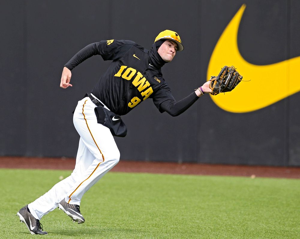 Iowa Hawkeyes right fielder Ben Norman (9) pulls in a fly ball for an out during the second inning of their game against Illinois at Duane Banks Field in Iowa City on Saturday, Mar. 30, 2019. (Stephen Mally/hawkeyesports.com)