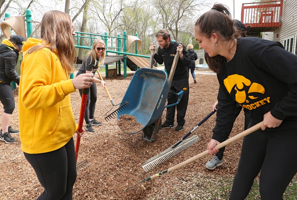 Iowa field hockey players re-mulch the playground at the HACAP Coral Ridge Head Start Center during the 21st annual ISAAC Hawkeye Day of Caring in Coralville on Sunday, Apr. 28, 2019. (Stephen Mally/hawkeyesports.com)