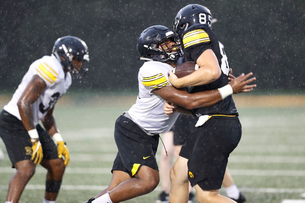 Iowa Hawkeyes linebacker Djimon Colbert (32) and tight end Nate Vejvoda (85) during camp practice No. 15  Monday, August 20, 2018 at the Hansen Football Performance Center. (Brian Ray/hawkeyesports.com)