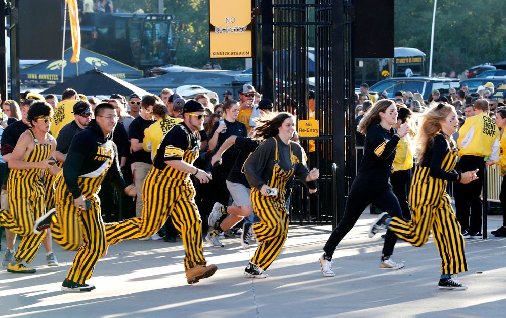 Students run to get seats before the Iowa Hawkeyes game against the Wisconsin Badgers Saturday, September 22, 2018 at Kinnick Stadium. (Brian Ray/hawkeyesports.com)