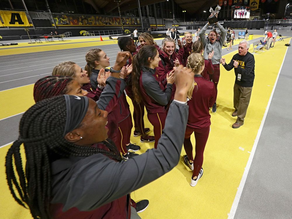 Larry Wieczorek hands out the women’s team award to Minnesota during the Larry Wieczorek Invitational at the Recreation Building in Iowa City on Saturday, January 18, 2020. (Stephen Mally/hawkeyesports.com)