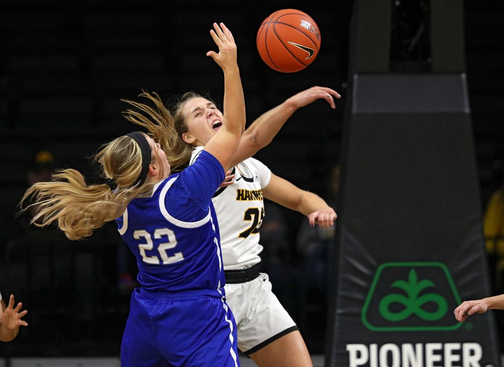 Iowa Hawkeyes guard Kathleen Doyle (22) blocks a shot by Drake Bulldogs guard Hannah Fuller (22) during the second quarter of their game at Carver-Hawkeye Arena in Iowa City on Saturday, December 21, 2019. (Stephen Mally/hawkeyesports.com)