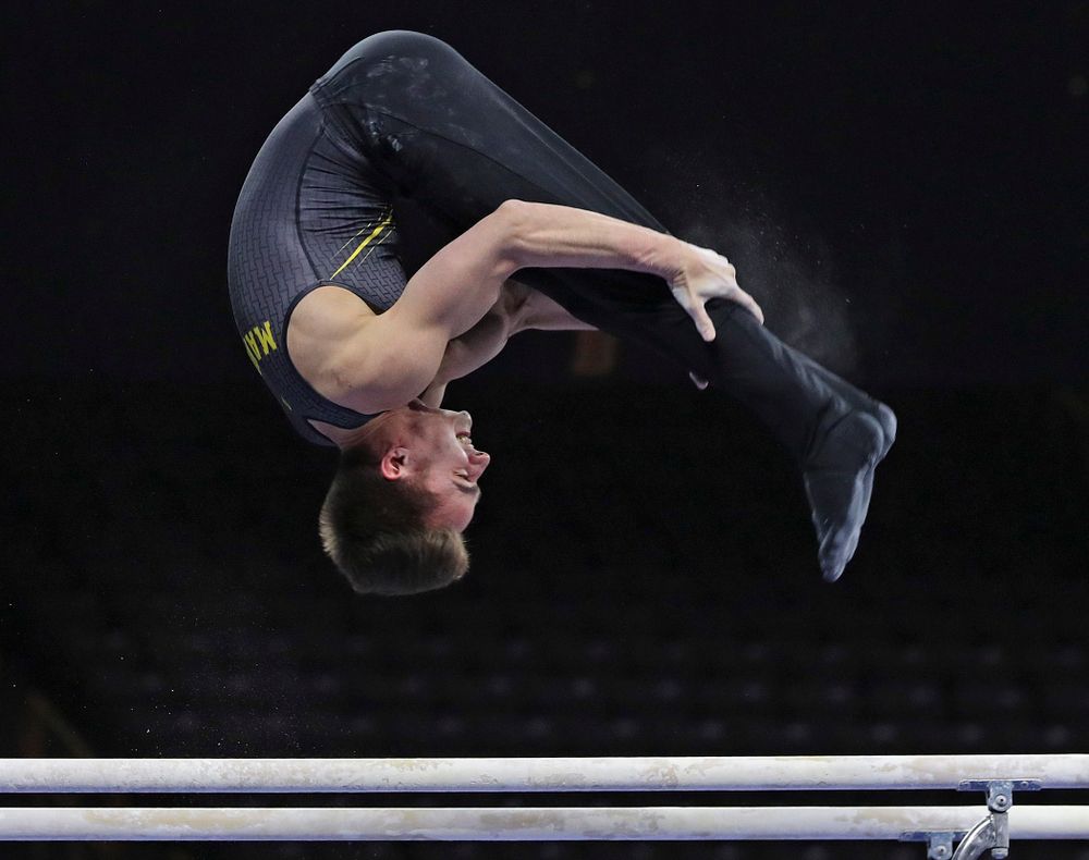 Iowa's Mitch Mandozzi competes in the parallel bars during the first day of the Big Ten Men's Gymnastics Championships at Carver-Hawkeye Arena in Iowa City on Friday, Apr. 5, 2019. (Stephen Mally/hawkeyesports.com)