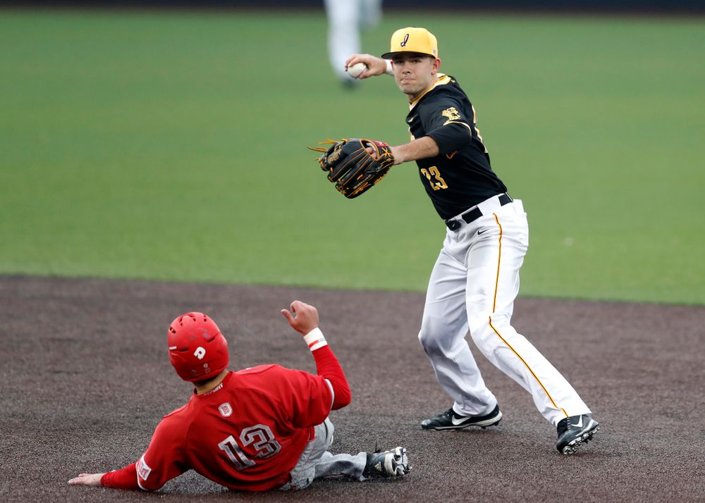 Iowa Hawkeyes infielder Kyle Crowl (23) turns a double play against the Bradley Braves Wednesday, March 28, 2018 at Duane Banks Field. (Brian Ray/hawkeyesports.com)