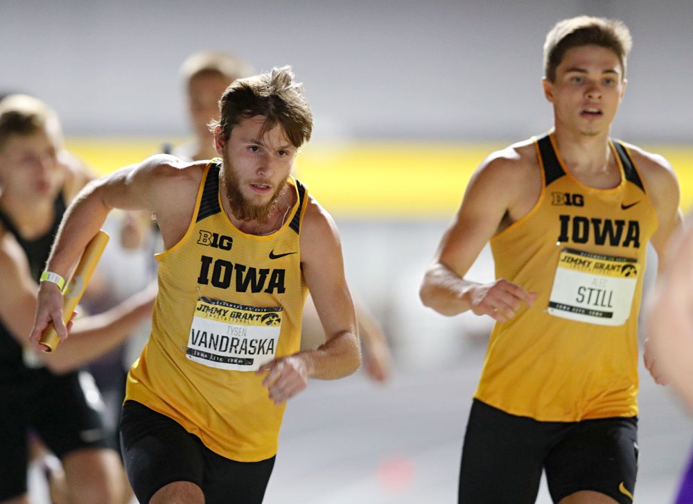 Iowa’s Tysen VanDraska (from left) runs after taking the baton from Alec Still during the men’s 1600 meter relay event during the Jimmy Grant Invitational at the Recreation Building in Iowa City on Saturday, December 14, 2019. (Stephen Mally/hawkeyesports.com)