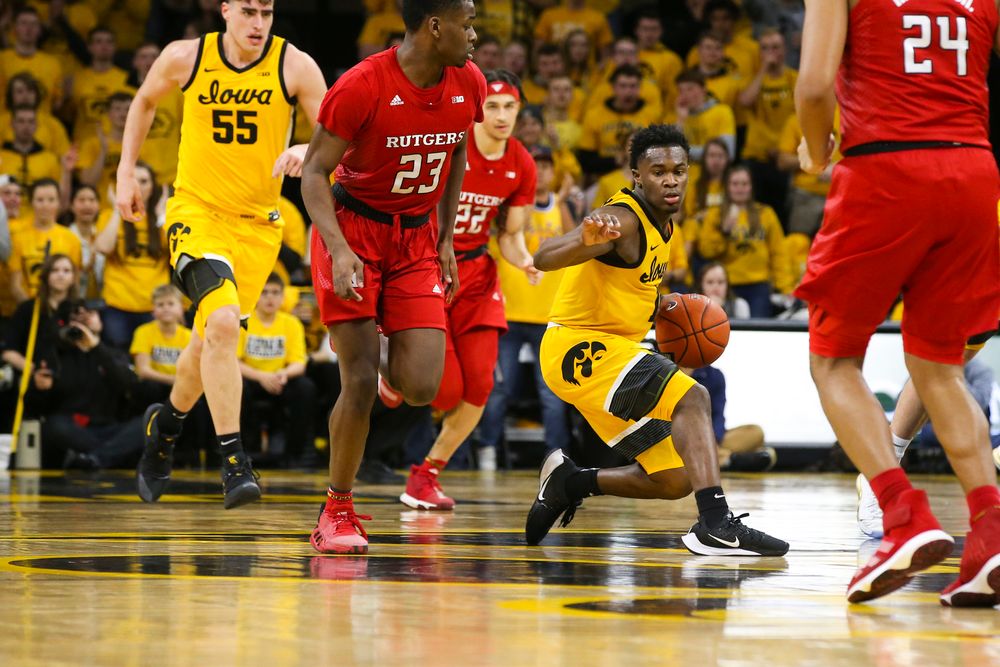 Iowa Hawkeyes guard Joe Toussaint (1) pivots around Rutgers guard Montez Mathis (23) during the Iowa men’s basketball game vs Rutgers on Wednesday, January 22, 2020 at Carver-Hawkeye Arena. (Lily Smith/hawkeyesports.com)