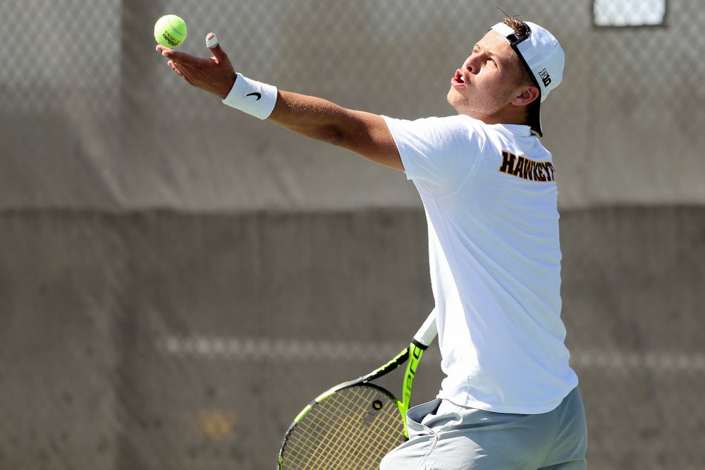 Iowa's Will Davies serves during his match against Michigan at the Hawkeye Tennis and Recreation Complex in Iowa City on Sunday, Apr. 21, 2019. (Stephen Mally/hawkeyesports.com)