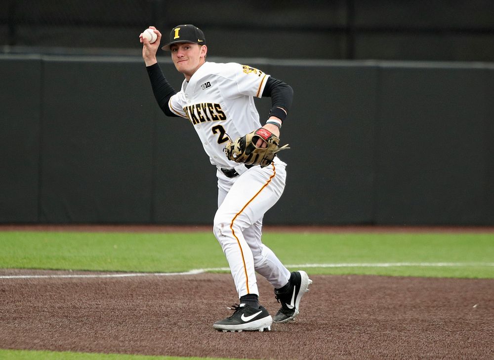 Iowa third baseman Brendan Sher (2) throws to first for an out during the second inning of their college baseball game at Duane Banks Field in Iowa City on Wednesday, March 11, 2020. (Stephen Mally/hawkeyesports.com)