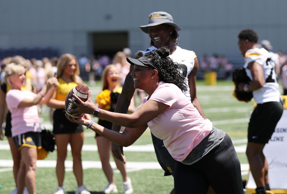 Tyjauna Smith makes a catch in front of her son, Iowa Hawkeyes wide receiver Brandon Smith (12), during the 2019 Iowa Ladies Football Academy Saturday, June 8, 2019 at the Hansen Football Performance Center. (Brian Ray/hawkeyesports.com)