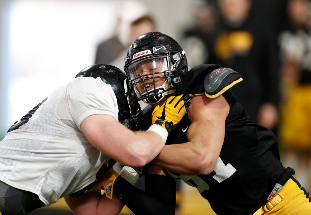 Iowa Hawkeyes tight end Noah Fant (87) and defensive end Parker Hesse (40) during spring practice Wednesday, March 28, 2018 at the Hansen Football Performance Center.  (Brian Ray/hawkeyesports.com)