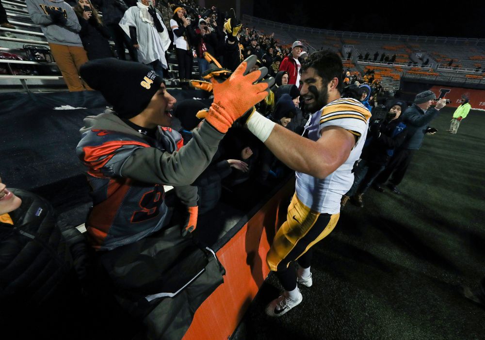 Iowa Hawkeyes defensive end A.J. Epenesa (94) hugs his little brother following their game against the Illinois Fighting Illini Saturday, November 17, 2018 at Memorial Stadium in Champaign, Ill. (Brian Ray/hawkeyesports.com)