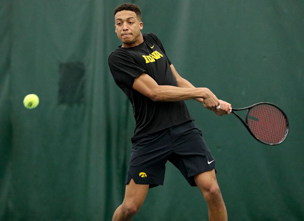 Iowa’s Oliver Okonkwo lines up a shot during his doubles match at the Hawkeye Tennis and Recreation Complex in Iowa City on Friday, February 14, 2020. (Stephen Mally/hawkeyesports.com)