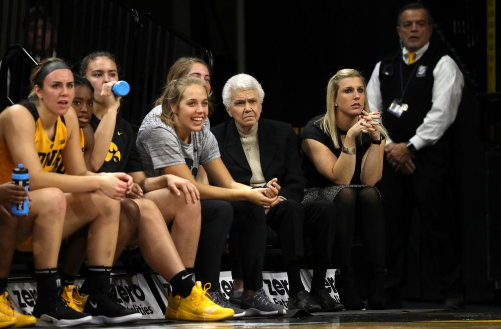 Dr. Christine Grant sits on the Iowa Hawkeyes bench during their game  against the Robert Morris Colonials Sunday, December 2, 2018 at Carver-Hawkeye Arena. (Brian Ray/hawkeyesports.com)