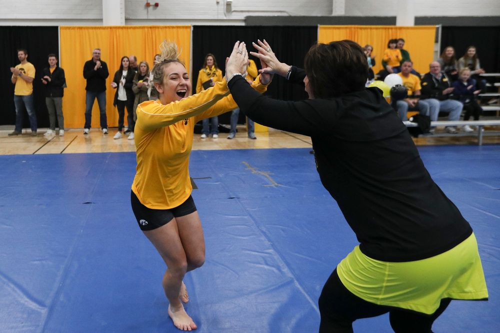 Alex Greenwald high fives assistant coach Jennifer Green during the Iowa women’s gymnastics Black and Gold Intraquad Meet on Saturday, December 7, 2019 at the UI Field House. (Lily Smith/hawkeyesports.com)