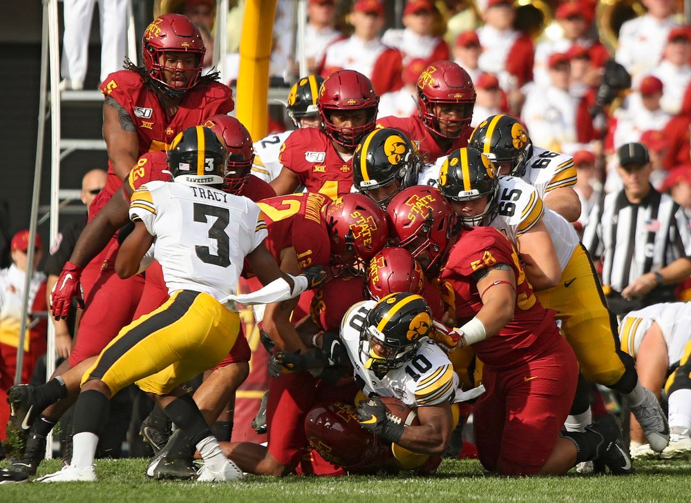 Iowa Hawkeyes running back Mekhi Sargent (10) pushes for extra yards on a run during the first quarter of their Iowa Corn Cy-Hawk Series game at Jack Trice Stadium in Ames on Saturday, Sep 14, 2019. (Stephen Mally/hawkeyesports.com)