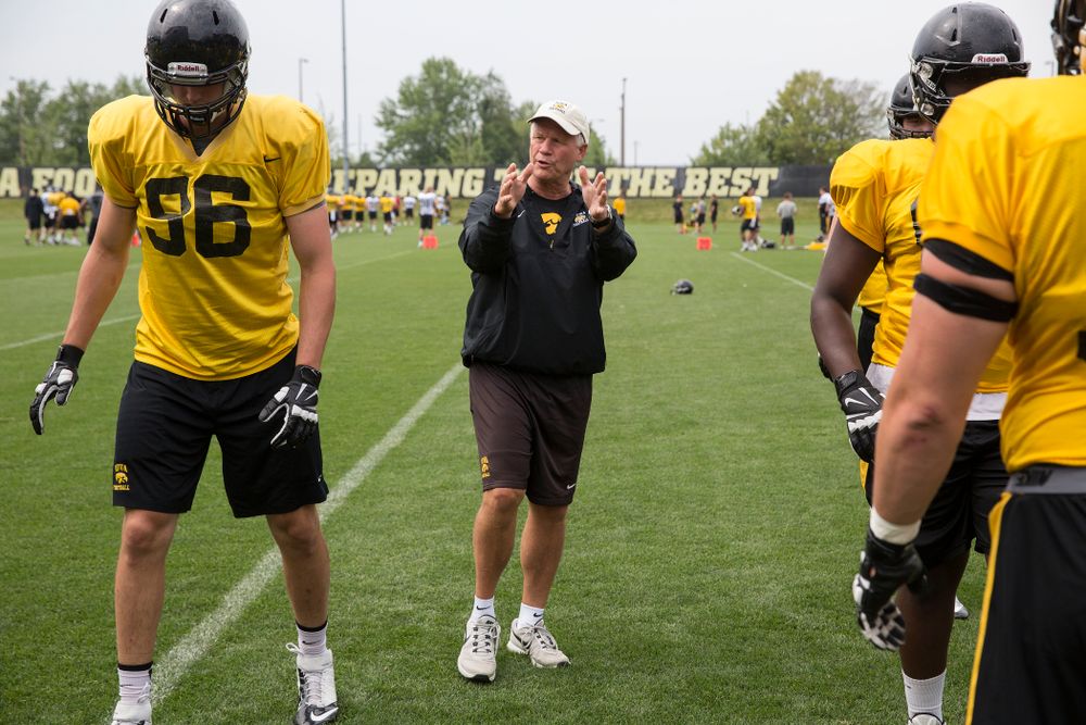 Iowa Hawkeyes Defensive Line coach Reese Morgan works with his unit during the team's eighth practice of camp Sunday, Aug. 10, 2014 at the Hayden Fry Football Complex in Iowa City.  (Brian Ray/hawkeyesports.com)