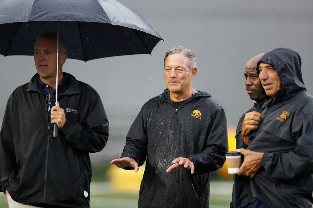 Iowa Hawkeyes head coach Kirk Ferentz  talks with BTN's Gerry DiNardo, Howard Griffith, and Chuck Long during camp practice No. 15  Monday, August 20, 2018 at the Hansen Football Performance Center. (Brian Ray/hawkeyesports.com)