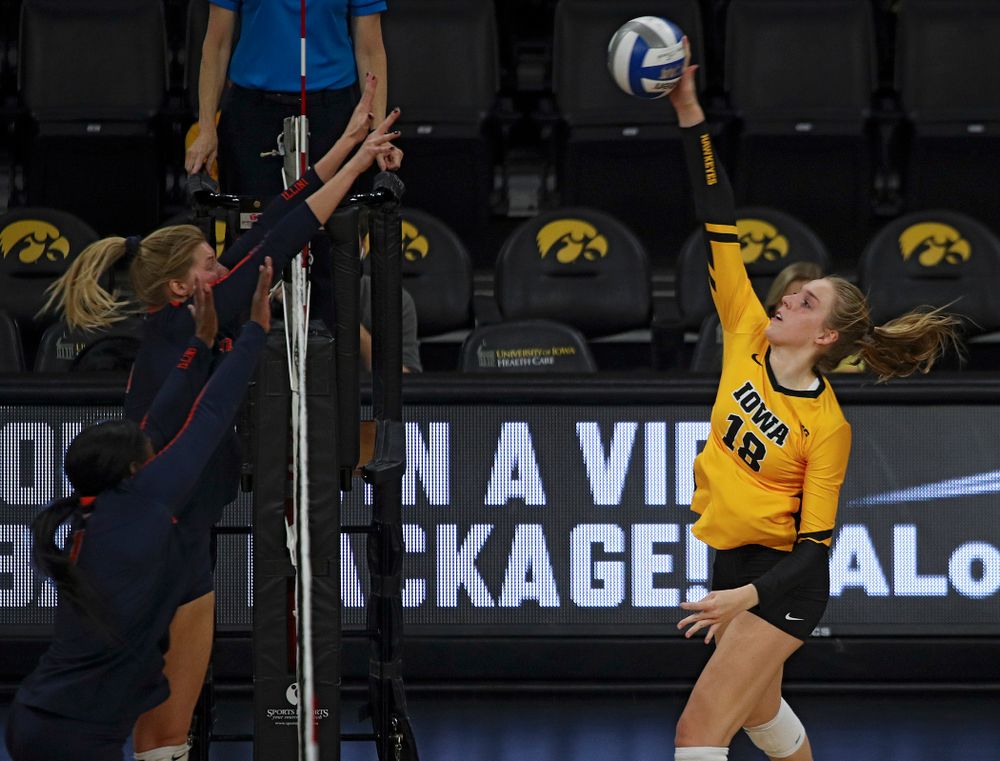 Iowa’s Hannah Clayton (18) gets a kill during the second set of their match against Illinois at Carver-Hawkeye Arena in Iowa City on Wednesday, Nov 6, 2019. (Stephen Mally/hawkeyesports.com)