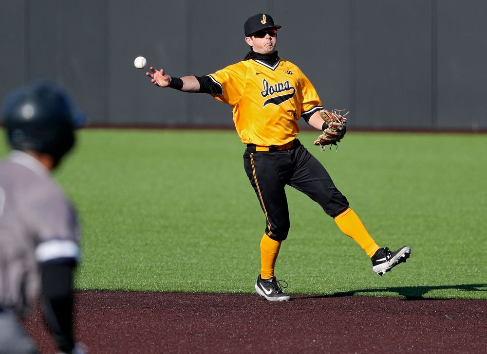 Iowa Hawkeyes second baseman Mitchell Boe (4) throws to first for an out during the fourth inning of their game at Duane Banks Field in Iowa City on Tuesday, Apr. 2, 2019. (Stephen Mally/hawkeyesports.com)