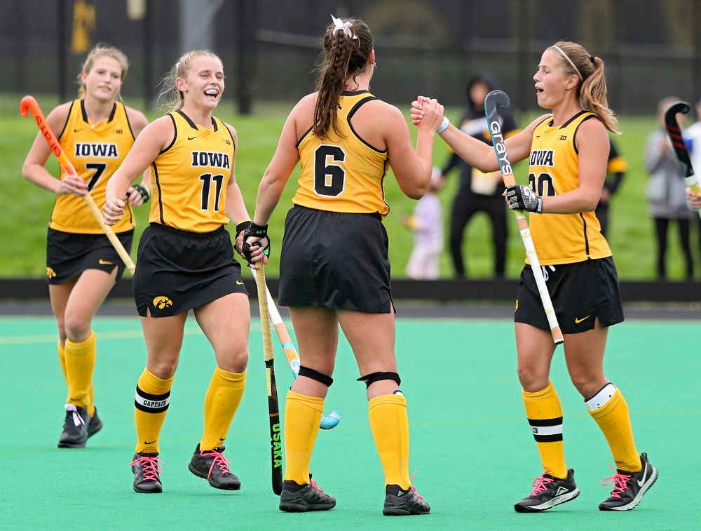 Iowa’s Anthe Nijziel (6) celebrates with Katie Birch (11) and Sophie Sunderland (20) after Nijziel scored a goal during the third quarter of their game against UC Davis at Grant Field in Iowa City on Sunday, Oct 6, 2019. (Stephen Mally/hawkeyesports.com)