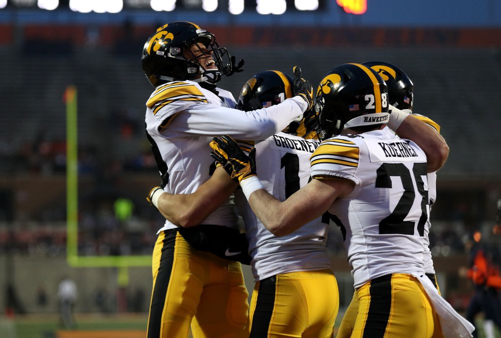 Iowa Hawkeyes wide receiver Kyle Groeneweg (14) celebrates with defensive back Julius Brents (20) after returning a punt for a touchdown against the Illinois Fighting Illini Saturday, November 17, 2018 at Memorial Stadium in Champaign, Ill. (Brian Ray/hawkeyesports.com)