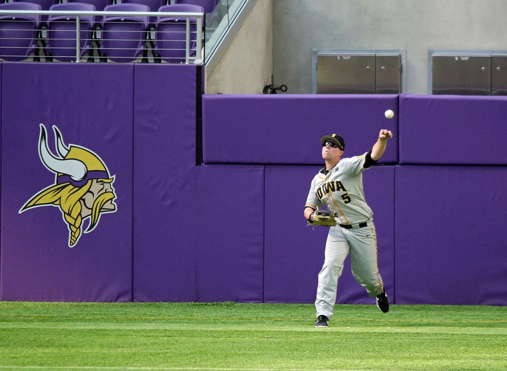 Iowa Hawkeyes outfielder Zeb Adreon (5) throws the ball back to the infield during the eighth inning of their CambriaCollegeClassic game at U.S. Bank Stadium in Minneapolis, Minn. on Friday, February 28, 2020. (Stephen Mally/hawkeyesports.com)
