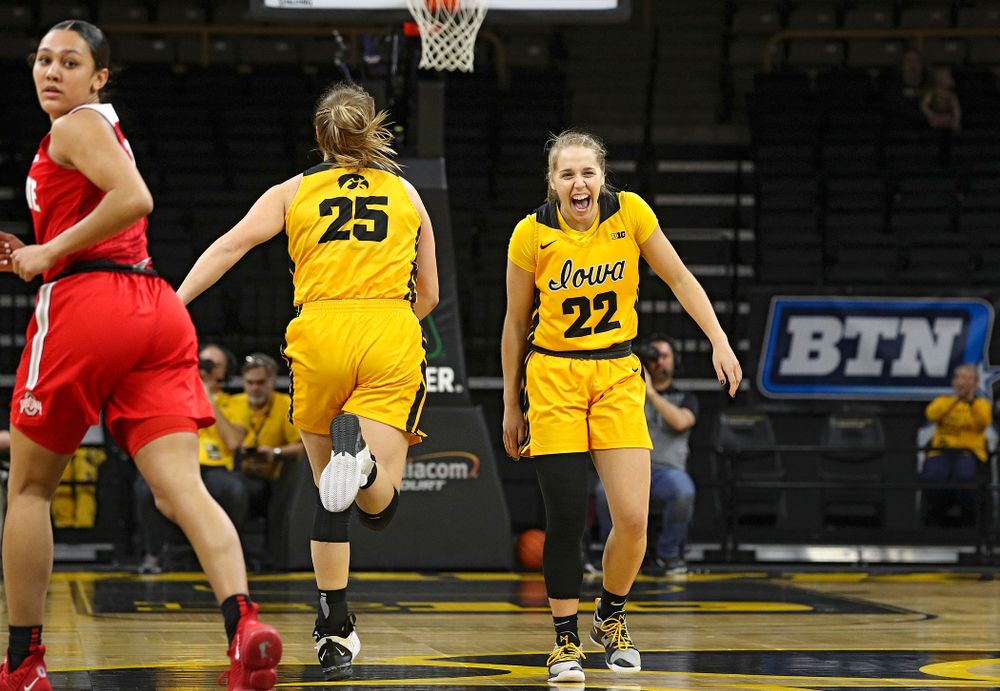 Iowa Hawkeyes guard Kathleen Doyle (22) shares a laugh with forward Monika Czinano (25) during the first quarter of their game at Carver-Hawkeye Arena in Iowa City on Thursday, January 23, 2020. (Stephen Mally/hawkeyesports.com)