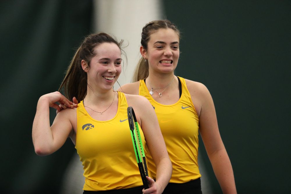 Iowa's Sam Mannix and Sophie Clark celebrate after winning their doubles match against Xavier Friday, January 18, 2019 at the Hawkeye Tennis and Recreation Center. (Brian Ray/hawkeyesports.com)